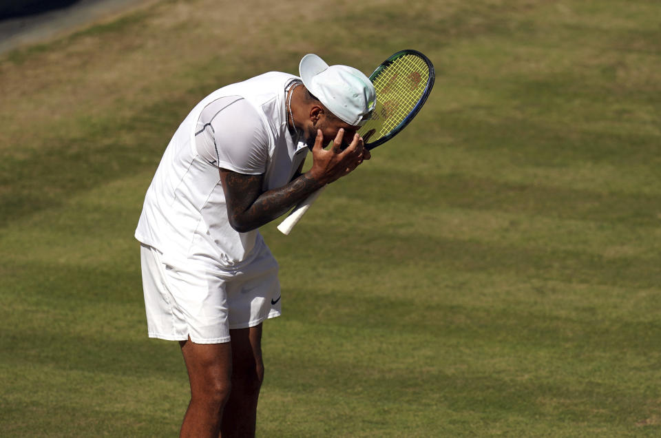 Australia's Nick Kyrgios reacts as he plays Serbia's Novak Djokovic in the final of the men’s singles on day fourteen of the Wimbledon tennis championships in London, Sunday, July 10, 2022. (John Walton/PA via AP)