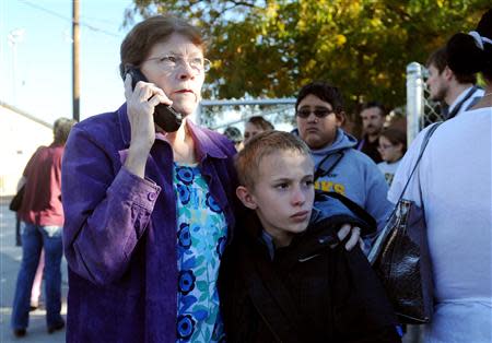 A parents pick up his their students Sparks high after a shooting at Sparks Middle School in Sparks, Nevada, October 21, 2013. REUTERS/Andy Barron/Reno Gazette-Journal