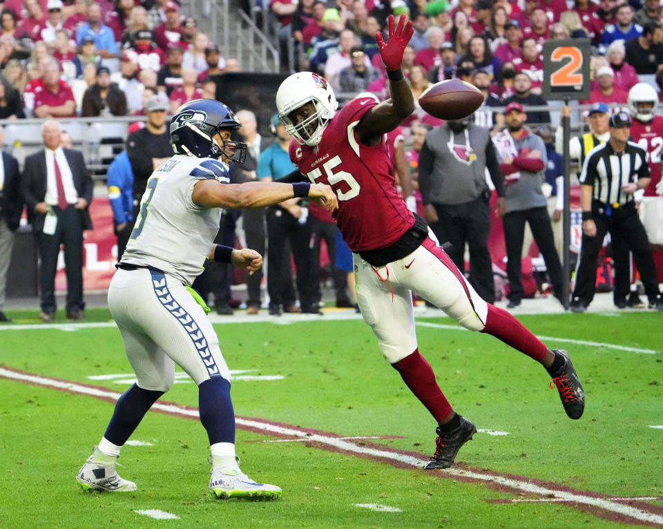 Jan 9, 2022; Glendale, Arizona, USA; Arizona Cardinals outside linebacker Chandler Jones (55) pressures the pass by Seattle Seahawks quarterback Russell Wilson (3) in the first half at State Farm Stadium. Mandatory Credit: Rob Schumacher-Arizona Republic