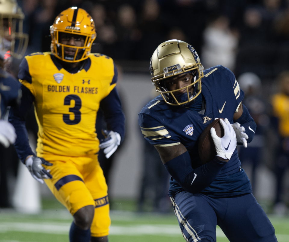 The University of Akron's Daniel George scores a touchdown Wednesday night against Kent State in Akron.