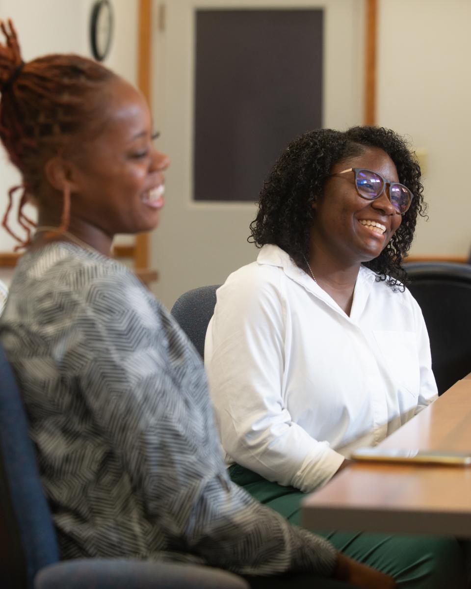 Kayla Adams, left, a biology major from Central State University,  and India Myers, of Oakwood University, talk about how the two got along during their summer research fellows program through Kansas State's College of Agriculture and Research and Extension Diversity Programs Office.