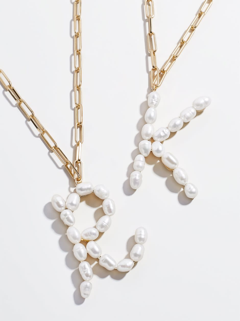 Blair Hera Pearl Initial Pendant. Image via Baublebar.