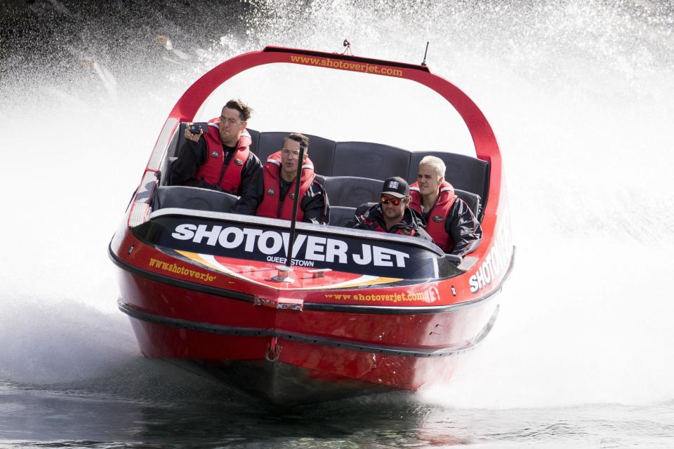 Biebs boards a boat and looks, well bored...