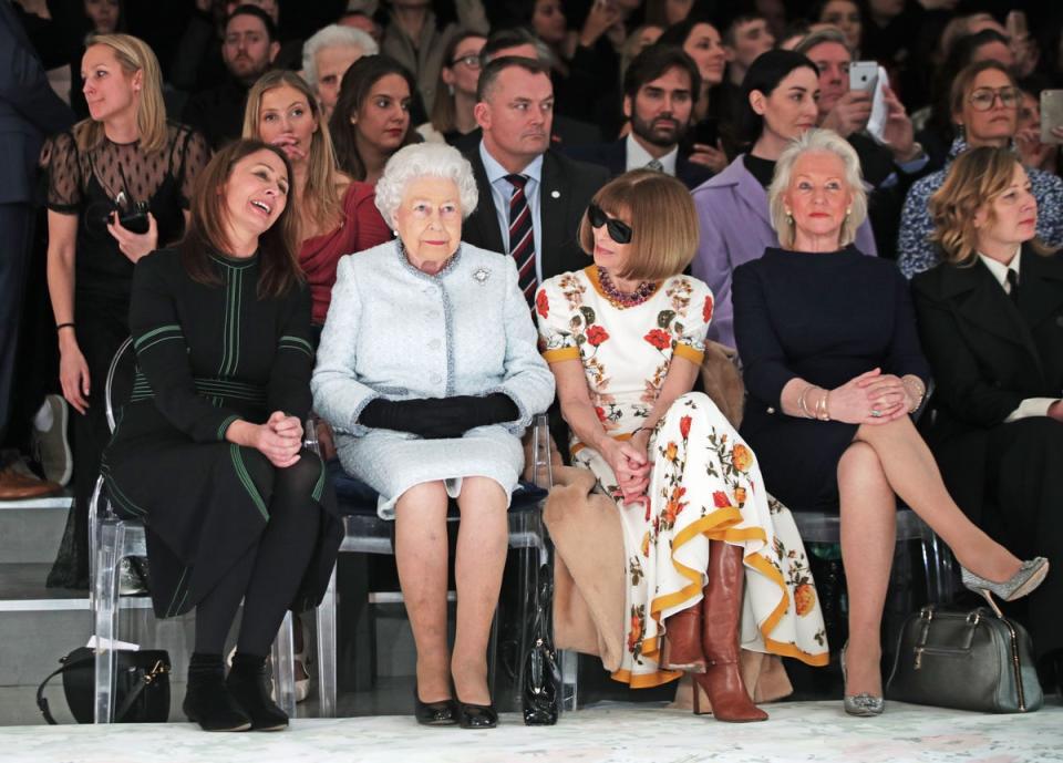 The Queen sits with Anna Wintour and royal dressmaker Angela Kelly (second right) at London Fashion Week (Yui Mok/PA) (PA Archive)