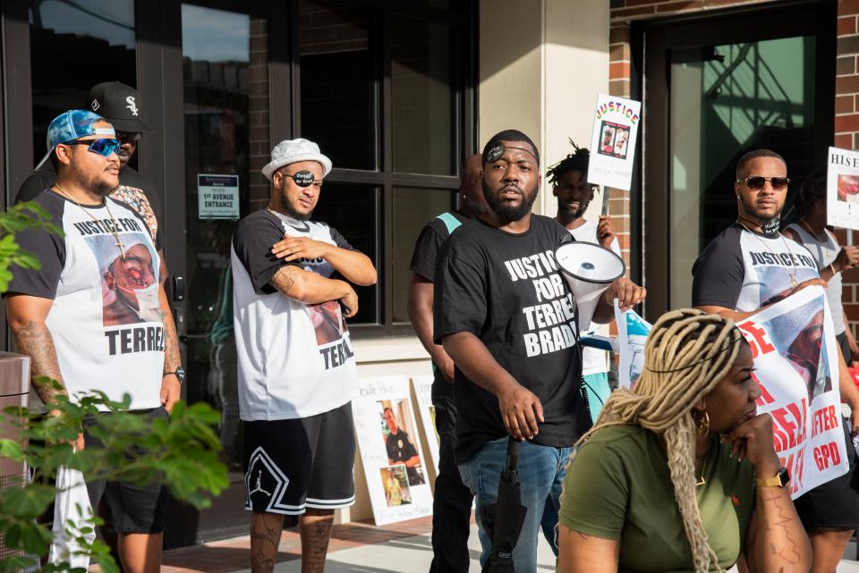 Protestors, friends and family of Terrell Bradley hold signs and speak during a protest for Bradley in Gainesville, Fla., on Sunday, July 17, 2022.