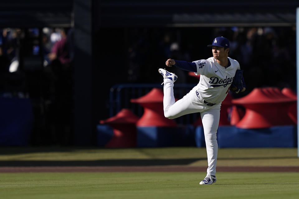 Los Angeles Dodgers starting pitcher Yoshinobu Yamamoto warms up prior to a baseball game against the Kansas City Royals Saturday, June 15, 2024, in Los Angeles. (AP Photo/Mark J. Terrill)