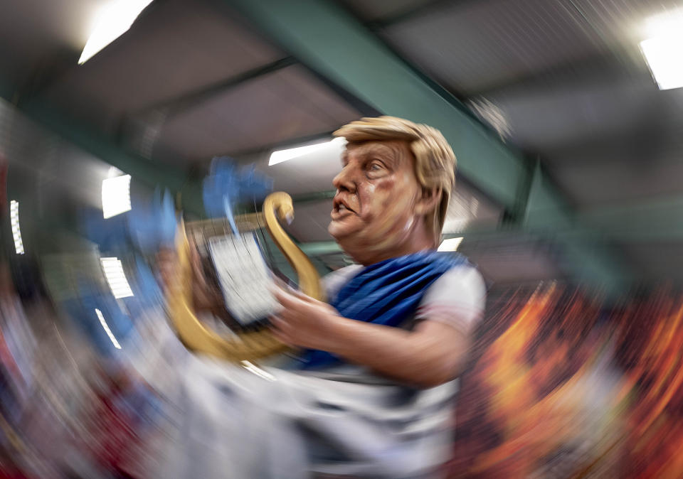 A figure depicting US President Donald Trump is shown during a press preview for the Mainz carnival, in Mainz, Germany, Tuesday, Feb. 18, 2020. (AP Photo/Michael Probst)