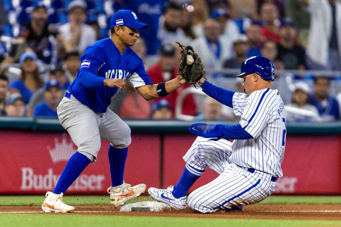 Nicaragua third baseman Benjamin Alegria (1) attempts to tag out Israel base runner Joc Pederson (23) during the first inning of a 2023 World Baseball Classic pool D game at loanDepot Park in Miami, Florida, on Sunday, March 12, 2023.