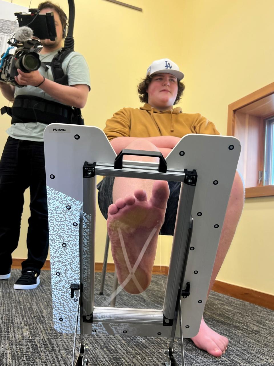 Representatives from PUMA flew to Michigan in April to measure Eric Kilburn Jr.'s feet at the Brandon Township Library. The company is making him custom basketball shoes that are "Eric-sized."