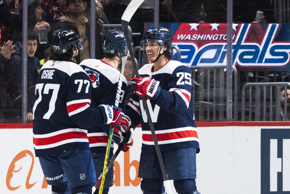 Washington Capitals defenseman Ethan Bear (25) celebrates with teammates after scoring a goal against the Anaheim Ducks during the first period of an NHL hockey game Tuesday, Jan. 16, 2024, in Washington. (AP Photo/Manuel Balce Ceneta)