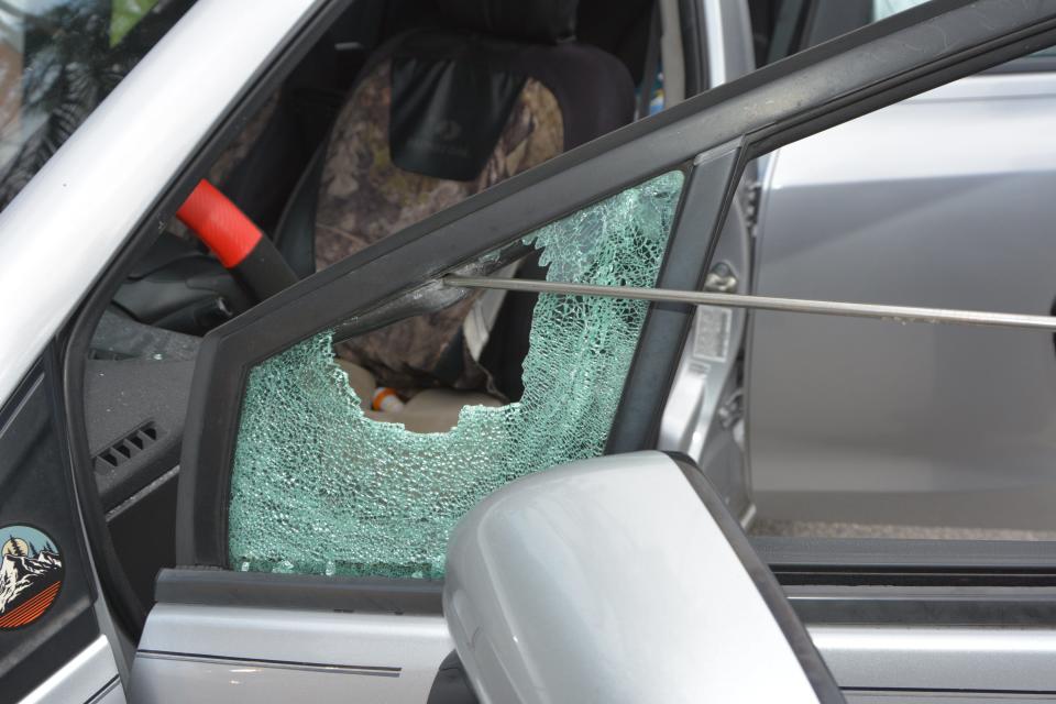 A broken side vent window shows where a 37-year-old man shot at a silver Honda in what police said was an act of self-defense during a dispute between drivers on Feb. 22 in Palm Beach.