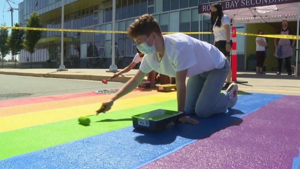 Students at Royal Bay Secondary in Colwood, B.C., had painted the rainbow crosswalk at their school only three days ago.  (CHEK News - image credit)