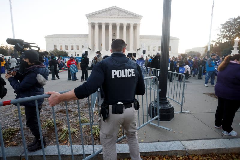 Anti-abortion and pro-abortion rights protesters gather outside Supreme Court in Washington