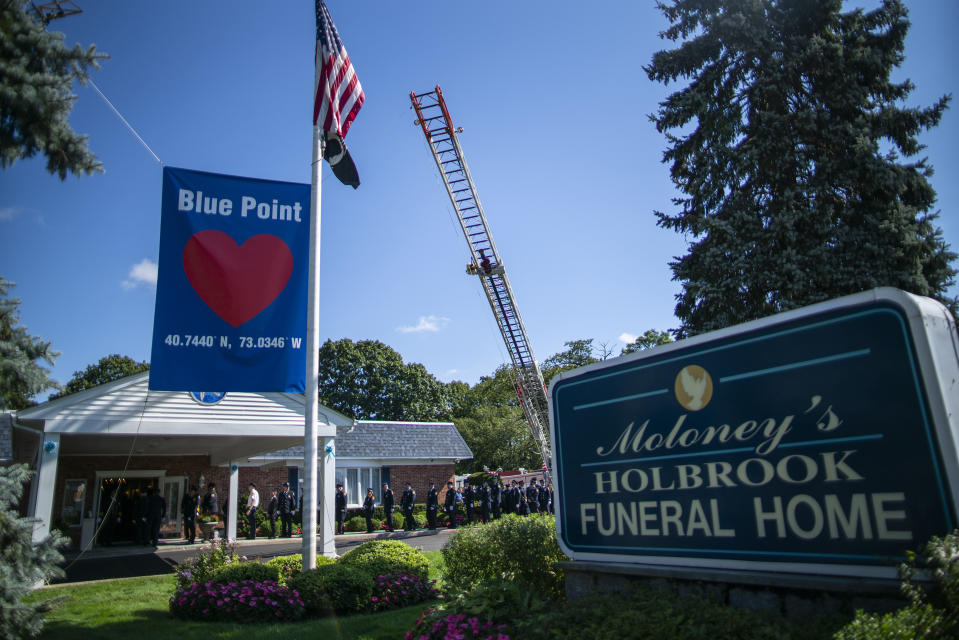 Long Island firefighters attend the funeral service of Gabby Petito at Moloney's Holbrook Funeral Home in Holbrook, N.Y. Sunday, Sept. 26, 2021. (AP Photo/Eduardo Munoz Alvarez)