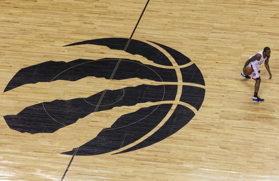 Toronto Raptors forward Kawhi Leonard brings the ball up during the first half of Game 6 of the team's NBA basketball playoffs Eastern Conference finals against the Milwaukee Bucks on Saturday, May 25, 2019, in Toronto. (Chris Young/The Canadian Press via AP)