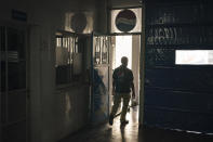 A Palestinian employee walks at the Pepsi bottling plant in Gaza City, Monday, June 21, 2021. Israel on Monday eased some restrictions on the Gaza Strip however the Pepsi factory announced today that it was closing and laying off workers because raw materials needed to stay in business are still not coming. (AP Photo/Felipe Dana)