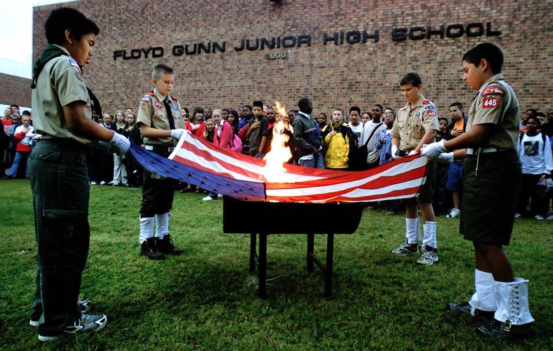 Oct. 11, 2001: A flag retiring ceremony at Gunn Junior High in Arlington, on a somber morning one month after the 9/11 terrorist attacks. Boy Scouts Christian Torres, 11, of Troop 393; Rhys L’Roy, 12, of Troop 445; Tyler Smith, 12, of Troop 445; and Marco Ponti, 12, of Troop 445 hold the flag that had flown over the school for over two years. The ceremony was part of eighth-grade Explorer Scout Tim Jackson’s Eagle Scout project. PAUL MOSELEY/STAR-TELEGRAM