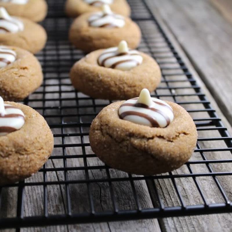<p>Taste and See</p><p>These white chocolate kissed gingerbread thumbprint cookies really are the perfect Christmas cookie!</p><p><strong>Get the recipe: <a href="https://tasteandsee.com/white-chocolate-gingerbread-thumbprint-cookies/" rel="nofollow noopener" target="_blank" data-ylk="slk:White Chocolate Gingerbread Thumbprint Cookies;elm:context_link;itc:0;sec:content-canvas" class="link rapid-noclick-resp">White Chocolate Gingerbread Thumbprint Cookies</a></strong></p>