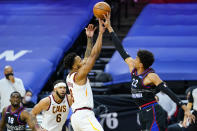 Philadelphia 76ers' Matisse Thybulle, right, blocks a shot by Cleveland Cavaliers' Lamar Stevens during the first half of an NBA basketball game, Saturday, Feb. 27, 2021, in Philadelphia. (AP Photo/Matt Slocum)