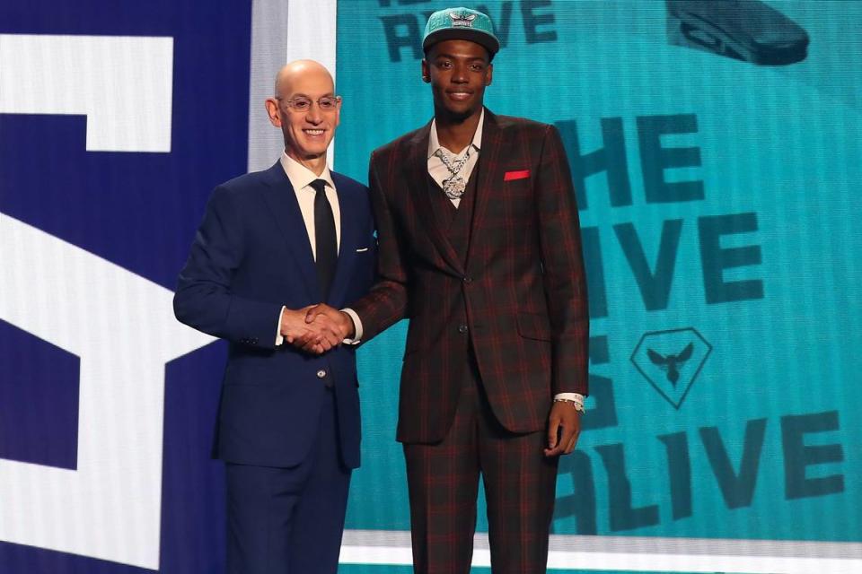 Brandon Miller poses with NBA commissioner Adam Silver after being selected second by the Charlotte Hornets in the first round of the 2023 NBA Draft at Barclays Arena.