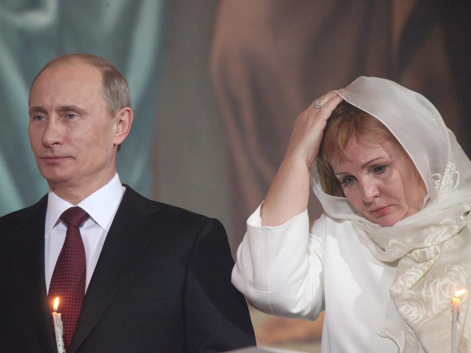 Prime Minister Vladimir Putin and his wife Lyudmila (R) pray during an Orthodox Easter service in the Christ the Saviour Cathedral on April 24, 2011 in Moscow. Russia
