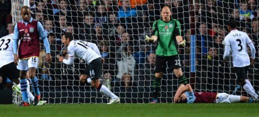 Manchester United's Mexican striker Javier Hernandez (3rd L) celebrates after scoring their third goal against Aston Villa at Villa Park. United came from 2-0 down to win the game 3-2 and pull four points clear at the top of the Premier League