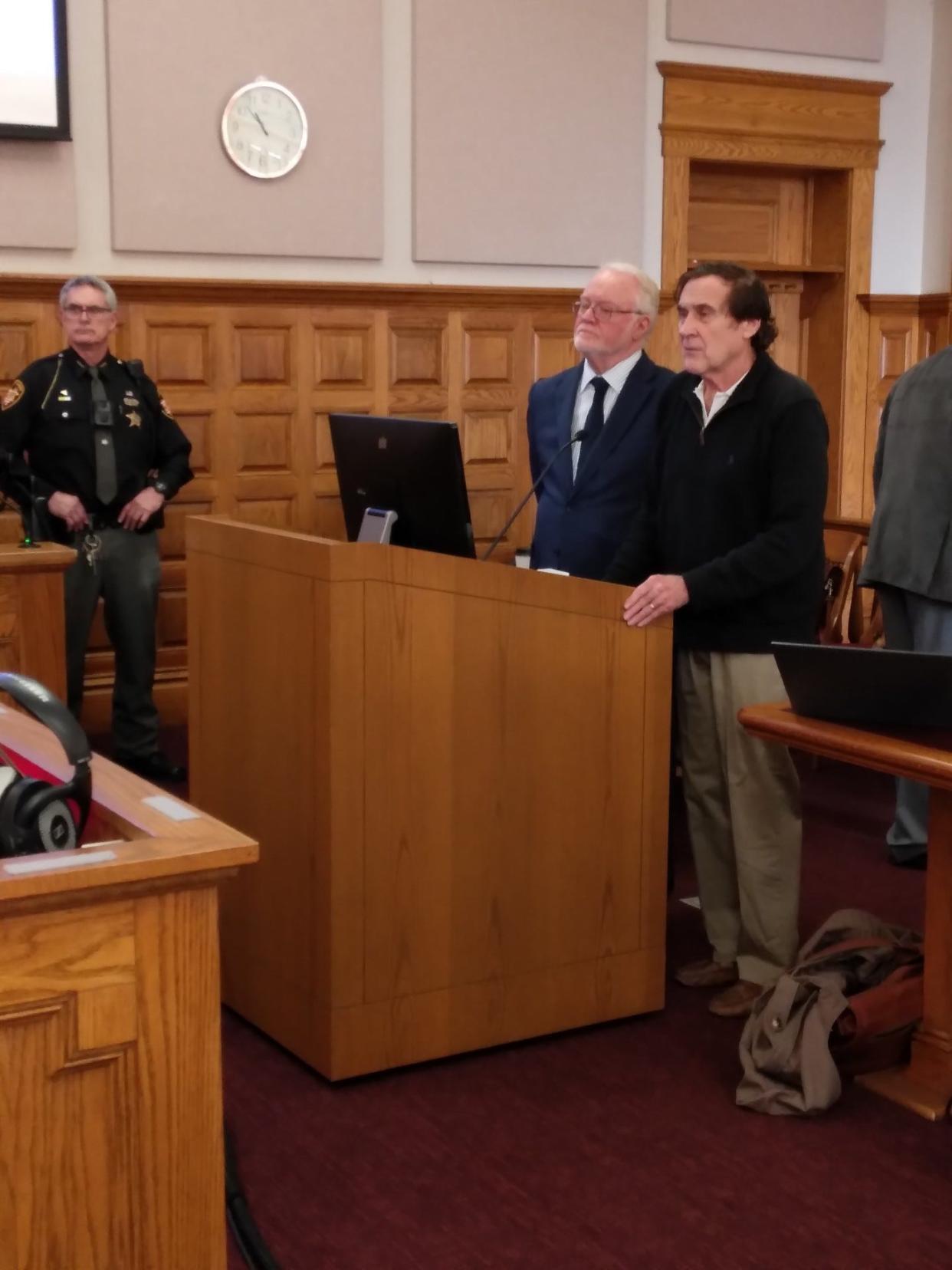 William R. Sparks, right, stands with his attorney Jeffrey Jakmides in Stark County Common Pleas Court on Wednesday, when Sparks pleaded guilty to six criminal counts. Judge Natalie R. Haupt dismissed the remaining 16 counts at the request of the special prosecutor.