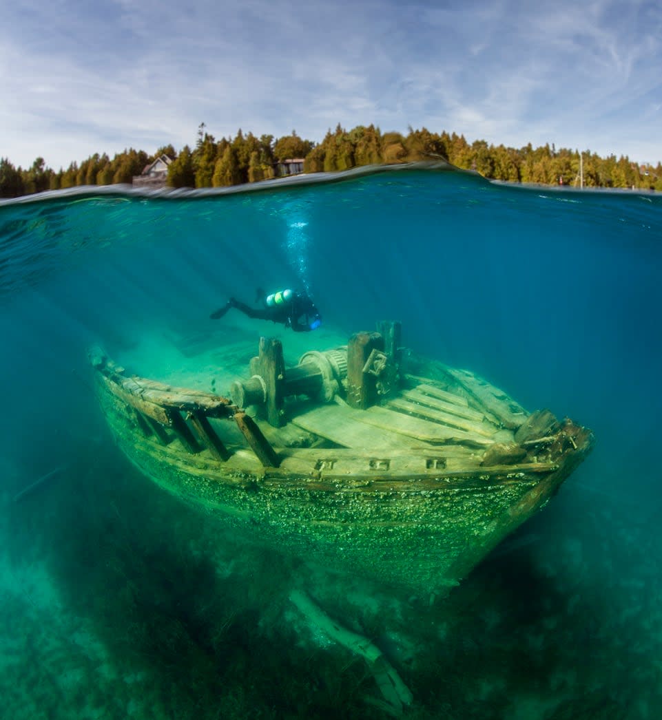 Jill Heinerth explores the wreck of the Sweepstakes in Big Tub Harbour near Tobermory, Ont. It's estimated over 6,000 shipwrecks are on the bottom of the Great Lakes, which, since the late 1600s, have been lost in wars, accidents, or frequent and powerful storms.  (Submitted by Jill Heinerth - image credit)