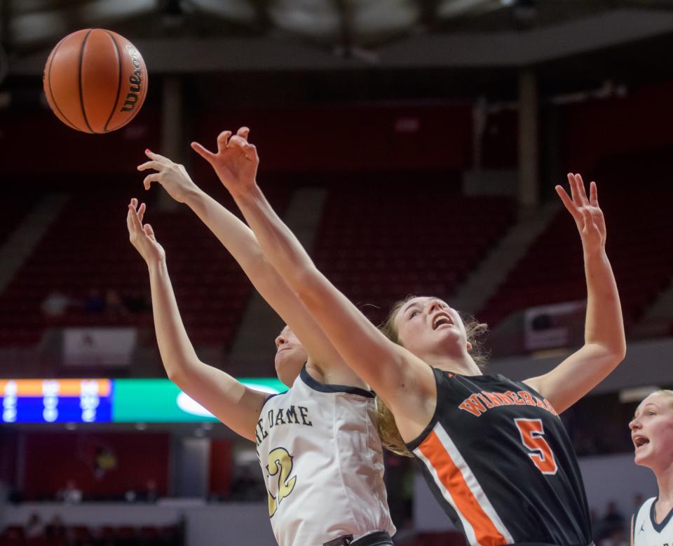 Winnebago's Renee Rittmeyer battle for a rebound with a Quincy Notre Dame player in the second half of their Class 2A state title game Saturday, March 5, 2022 at Redbird Arena in Normal. The Indians fell to the Irish 63-56.