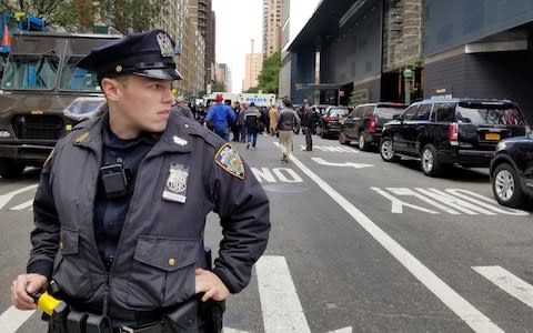 Police officers outside the Time Warner Building in New York - Credit: Anadolu Agency 