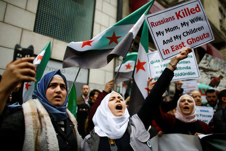 Syrians living in Istanbul gather in front of the Russian Consulate during a protest in Istanbul, Turkey February 22, 2018. REUTERS/Osman Orsal