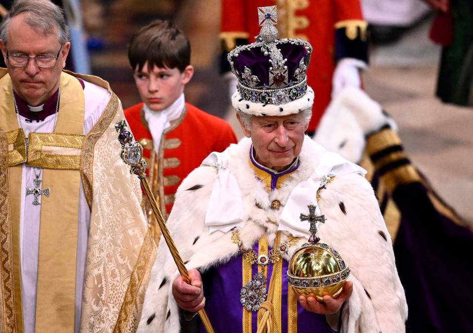 Britain's King Charles III departs following his Coronation Ceremony inside Westminster Abbey in central London, on May 6, 2023. - The set-piece coronation is the first in Britain in 70 years, and only the second in history to be televised. Charles will be the 40th reigning monarch to be crowned at the central London church since King William I in 1066. Outside the UK, he is also king of 14 other Commonwealth countries, including Australia, Canada, and New Zealand.