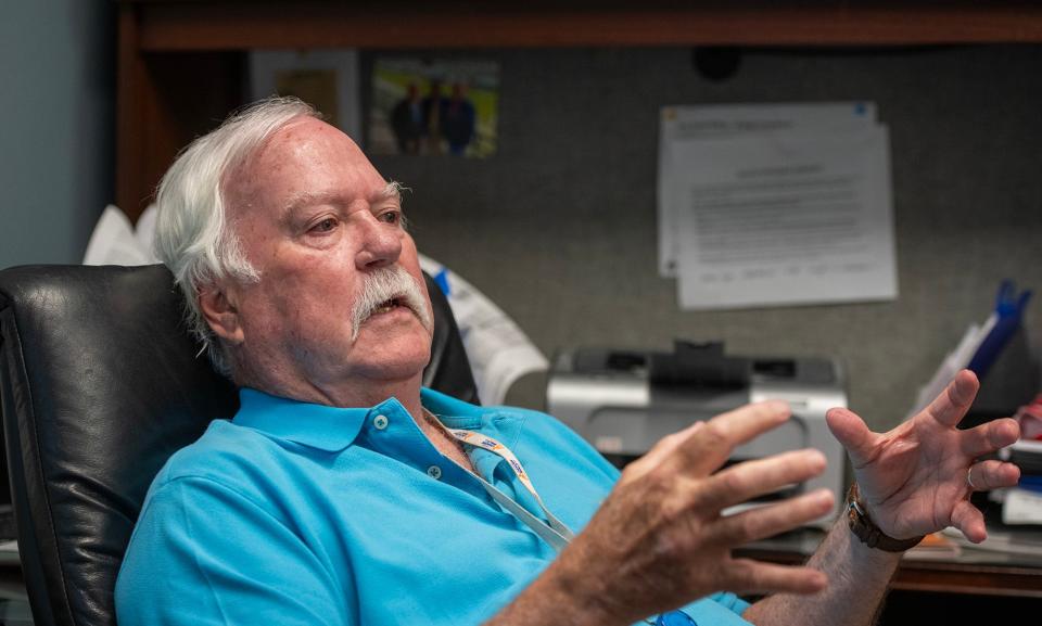 Dr. Robert Babineau Jr. talks about his father in his Fitchburg office.