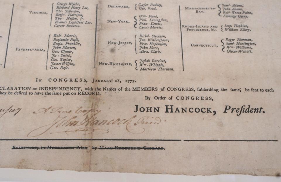 The signature of John Hancock on a copy of the Declaration of Independence at the State Archive.