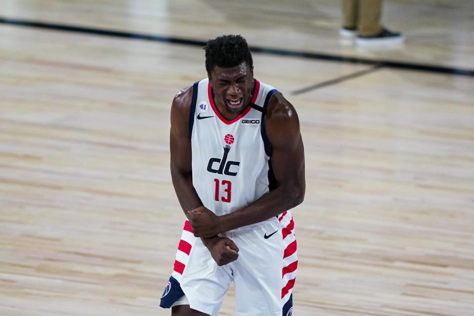 Washington Wizards center Thomas Bryant (13) reacts during the second half of an NBA basketball game against the Philadelphia 76ers Wednesday, Aug. 5, 2020 in Lake Buena Vista, Fla. (AP Photo/Ashley Landis)