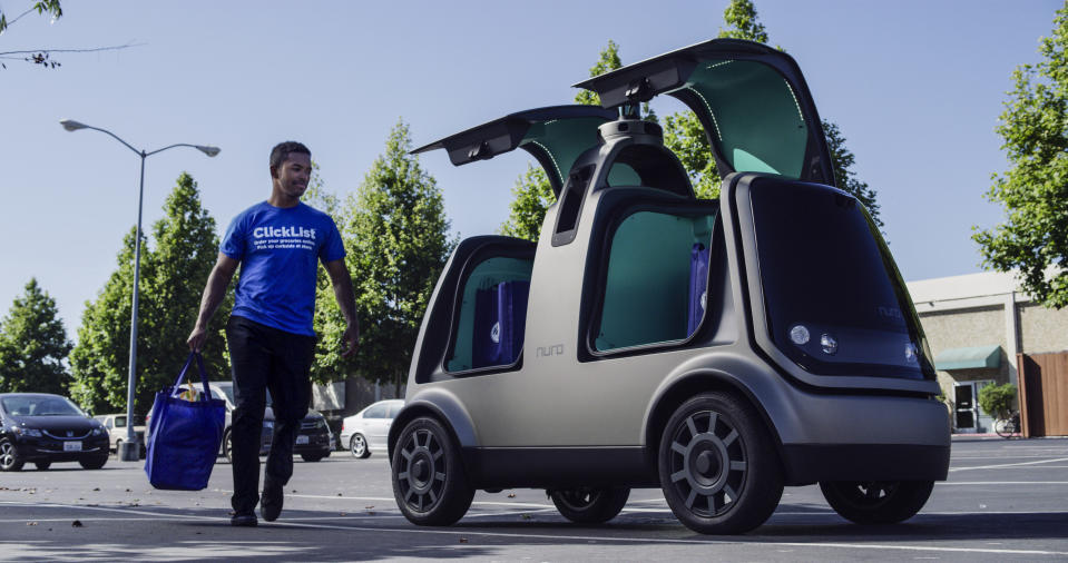 This undated image provided by The Kroger Co. shows an autonomous vehicle called the R1. Nuro and grocery chain Kroger are teaming up to bring unmanned delivery service to customers. The companies said Tuesday, Dec. 18, 2018, that Nuro's unmanned vehicle, the R1, will be added to a fleet of autonomous Prius vehicles that have run self-driving grocery delivery service in Scottsdale, Ariz., with vehicle operators since August. (Andrew Brown/The Kroger Co. via AP)