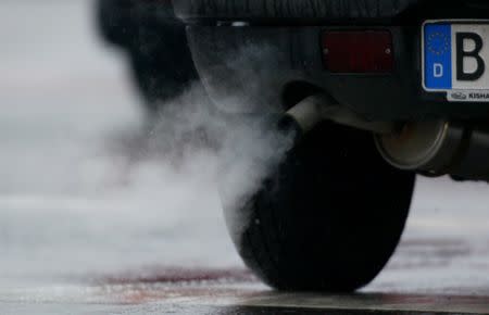 FILE PHOTO: Emissions well out of an exhaust in downtown Berlin, Germany, on March 23, 2005. REUTERS/Tobias Schwarz/File Photo