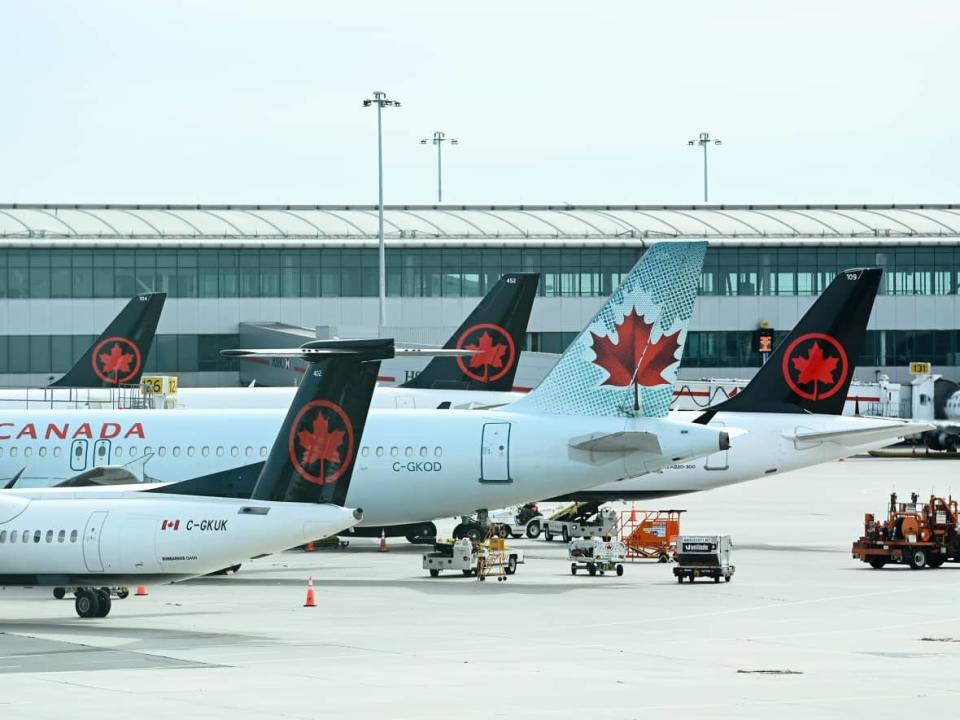 Passenger flights from Vancouver to Hong Kong will be suspended for two weeks due to a COVID-19 exposure on Oct. 13 on Air Canada Flight 007. (Nathan Denette/The Canadian Press - image credit)
