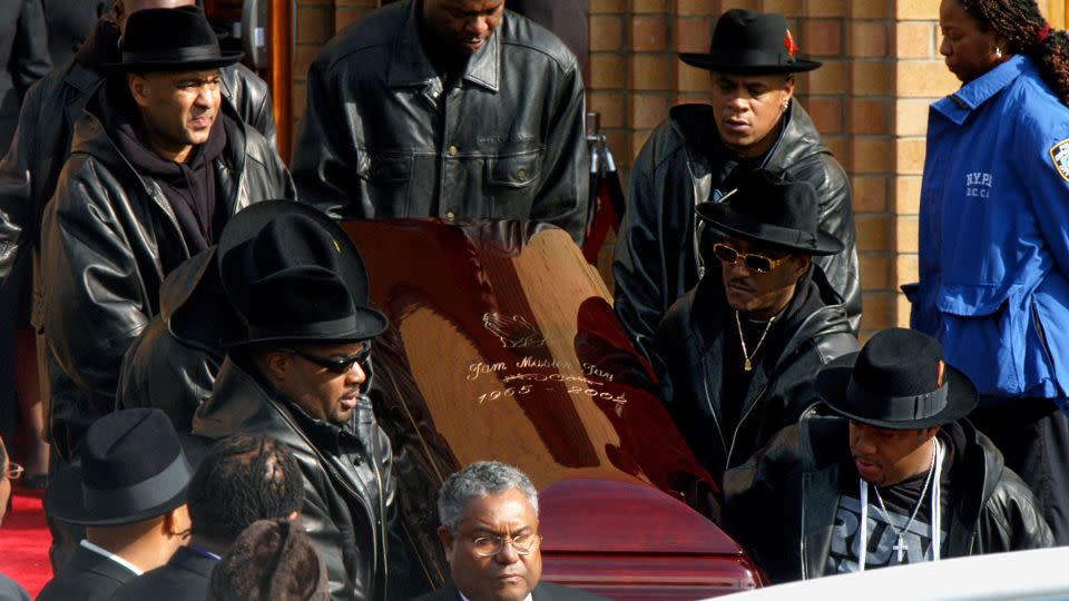 The coffin of Run-DMC's Jam Master Jay was carried out of Allen A.M.E Cathedral after his funeral on November 5, 2002. - Hanny Ray Abrams/AFP/Getty Images