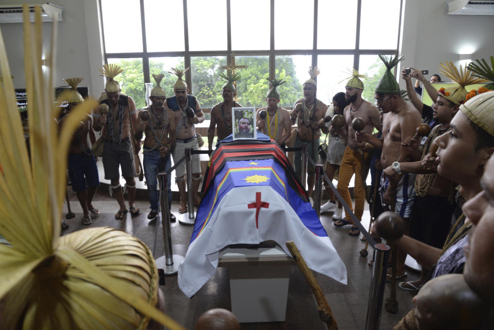 Indigenous people attend the funeral of Indigenous expert Bruno Pereira at the Morada da Paz cemetery, in Recife, Pernambuco state, Friday, June 24, 2022. Indigenous groups, family and friends paid their final respects to Pereira as he was laid to rest in his hometown of Recife. Pereira was killed in the Amazon region with the British journalist Dom Phillips. (AP Photo/Teresa Maia)