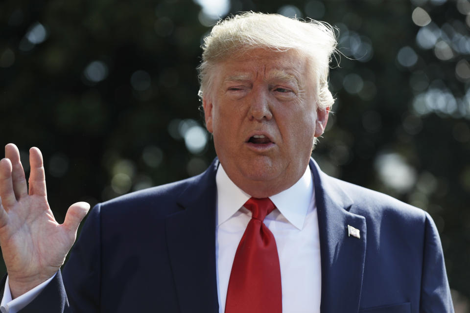 President Donald Trump talks to reporters on the South Lawn of the White House, Friday, Aug. 9, 2019, in Washington, as he prepares to leave Washington for his annual August holiday at his New Jersey golf club. (AP Photo/Evan Vucci)