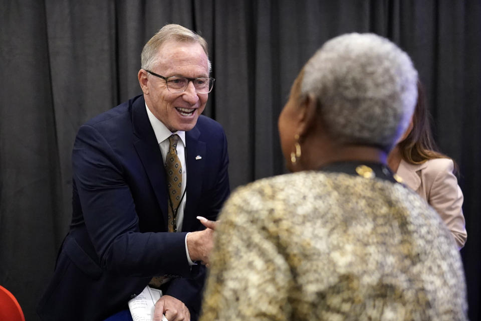 Mayor John Giles, left, of Mesa, Ariz., talks with Selena Dunham after a voting rights breakout session Tuesday, Sept. 20, 2022, in Houston. The National Nonpartisan Conversation on Voting Rights is holding meetings and seminars in Houston Tuesday and Wednesday. (AP Photo/David J. Phillip)