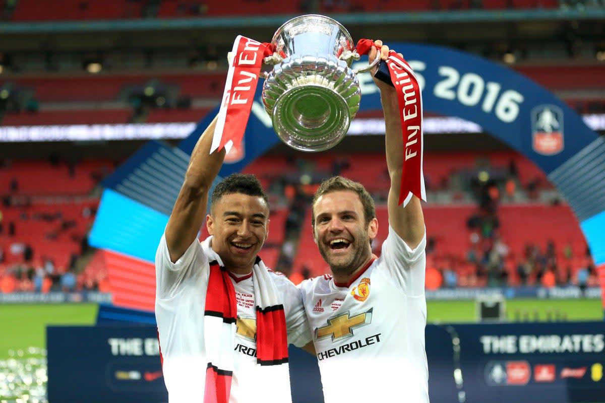 Juan Mata (right) travelled to Manchester United for a medical, on this day in 2014 (Mike Egerton/PA) (PA Archive)