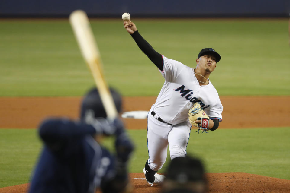 Miami Marlins' Jordan Yamamoto pitches to San Diego Padres' Manny Machado during the first inning a baseball game, Tuesday, July 16, 2019, in Miami. (AP Photo/Wilfredo Lee)