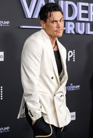 <p>Amanda Edwards/Getty Images</p> Tom Sandoval poses on the season 11 premiere red carpet
