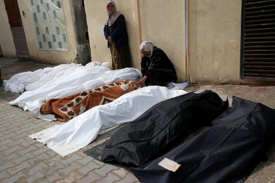 Palestinians mourn over their relatives killed in the Israeli bombardments of the Gaza Strip at Al Aqsa Hospital in Deir al Balah (Copyright 2024 The Associated Press. All rights reserved.)