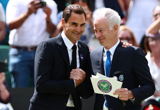 Roger Federer, pictured here greeting John McEnroe at the Wimbledon parade of champions.