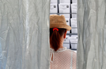 A woman is seen inside a polling station during Spain's general election in Madrid, Spain, April 28, 2019. REUTERS/Susana Vera