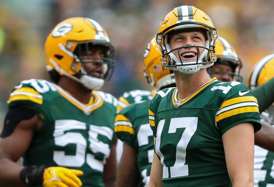 Green Bay Packers place kicker <a class="link " href="https://sports.yahoo.com/nfl/players/40214" data-i13n="sec:content-canvas;subsec:anchor_text;elm:context_link" data-ylk="slk:Anders Carlson;sec:content-canvas;subsec:anchor_text;elm:context_link;itc:0">Anders Carlson</a> (17) smiles as he looks up at the scoreboard after a kickoff against the <a class="link " href="https://sports.yahoo.com/nfl/teams/seattle/" data-i13n="sec:content-canvas;subsec:anchor_text;elm:context_link" data-ylk="slk:Seattle Seahawks;sec:content-canvas;subsec:anchor_text;elm:context_link;itc:0">Seattle Seahawks</a> during their preseason football game on Saturday, August 26, 2023, at Lambeau Field in Green Bay, Wis.<br>Tork Mason/USA TODAY NETWORK-Wisconsin