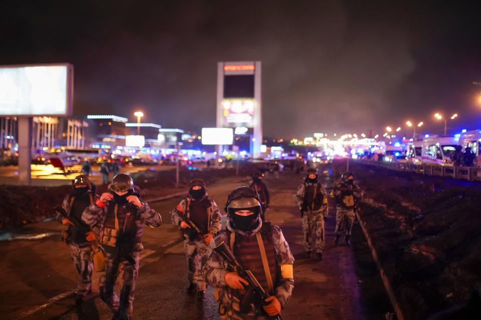 FILE - Russian soldiers secure an area at near the Crocus City Hall concert venue on the western edge of Moscow, Russia, on Saturday, March 23, 2024. The March 22 attack on the venue that killed over 140 people marked a major failure of Russian security agencies. (Alexander Avilov/Moscow News Agency via AP, File)